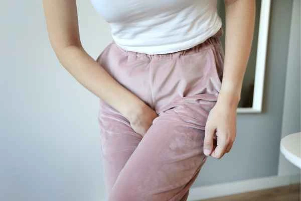 woman running for the toilet because of urinary incontinence Lower Morden
